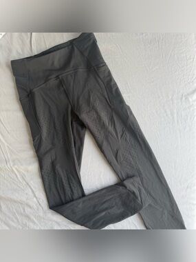 lululemon dark grey leggings size 4 with side pockets and perforated details